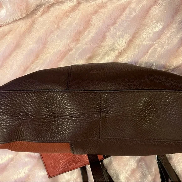 NWT large w/dust bag.   NEVER WORN RETAIL $198….temp.price cut for  auction - Picture 15 of 16